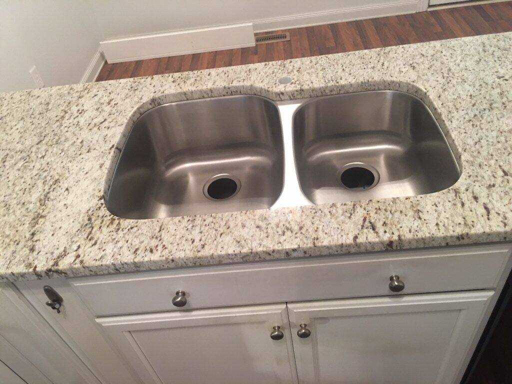 White Ornamental Granite Countertop with Stainless Steel Sink