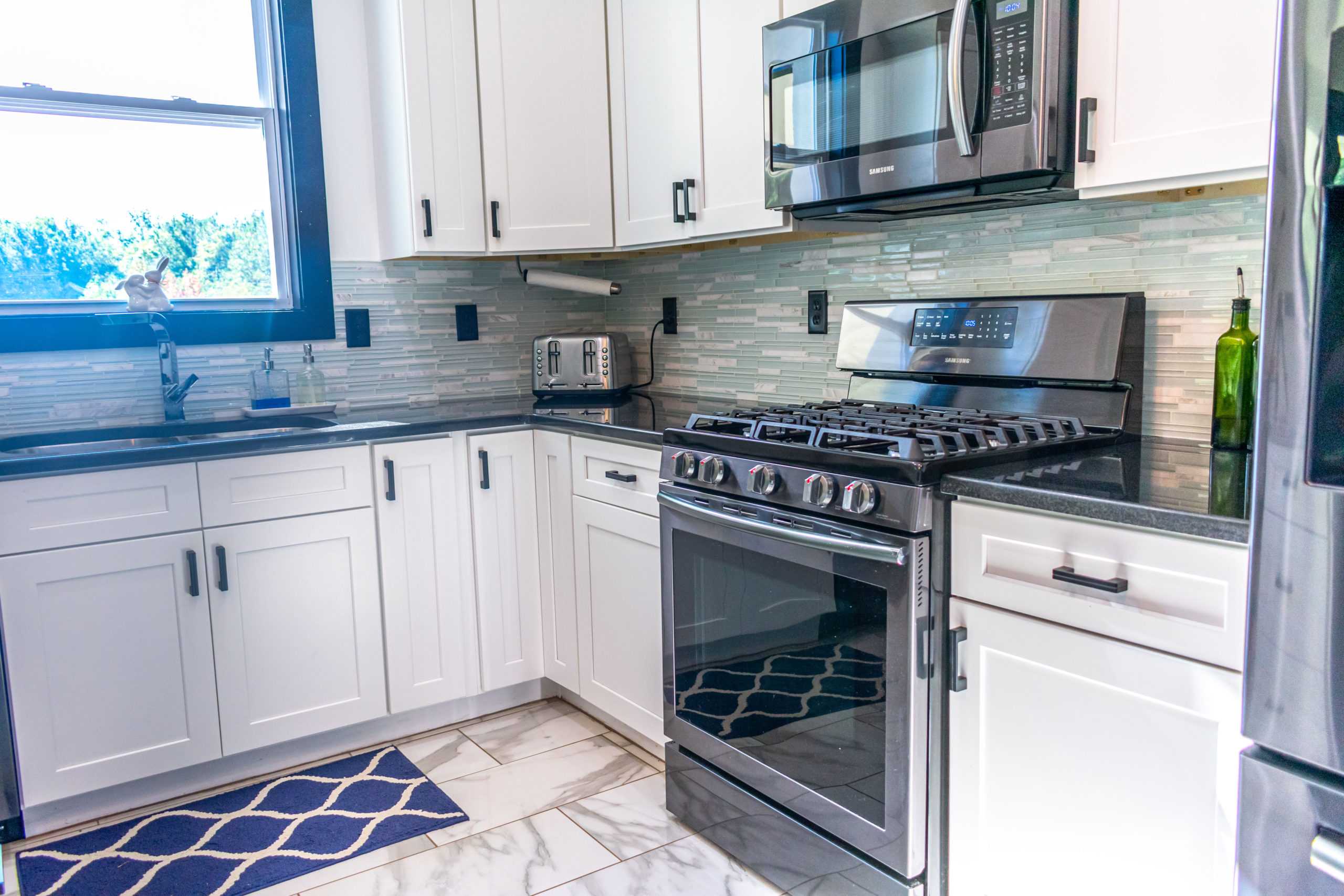 Absolute Black Granite Countertop with White Shaker Cabinets