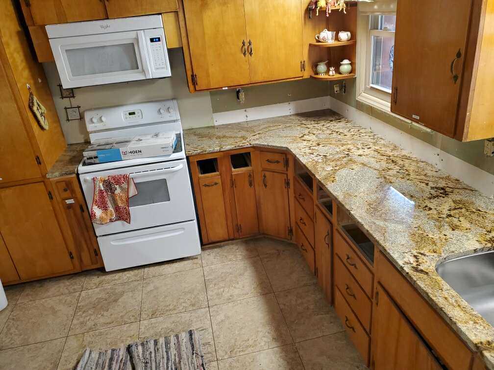 Jaguar Granite Countertop with Wood Cabinets