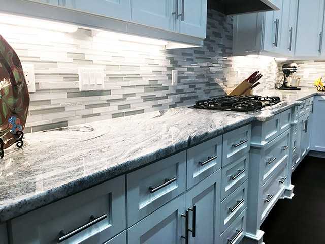 Viscon White Granite Kitchen Countertops with Tile Backsplash