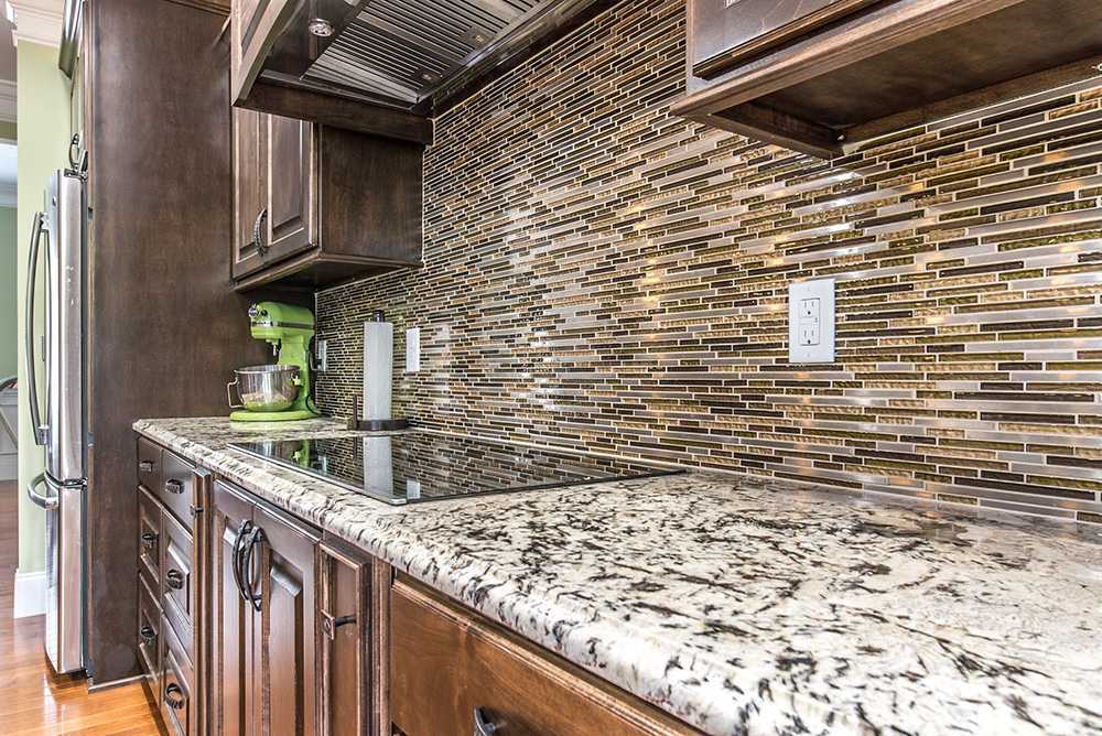 Delicatus White Granite Kitchen Countertop with Tile Backsplash