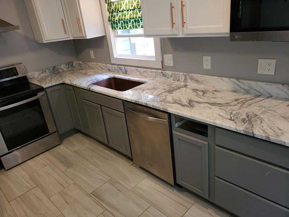 Mont Blanc Marble Countertops with Grey Cabinets