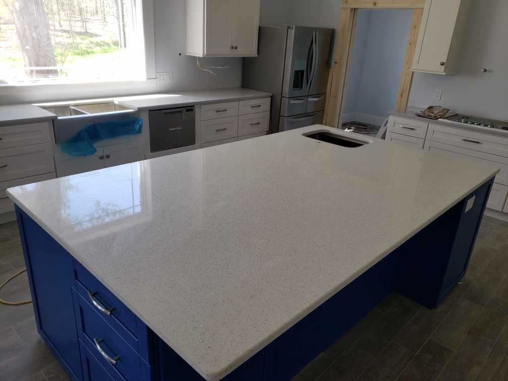 White Lace Quartz Kitchen Island with Blue Shaker Cabinets